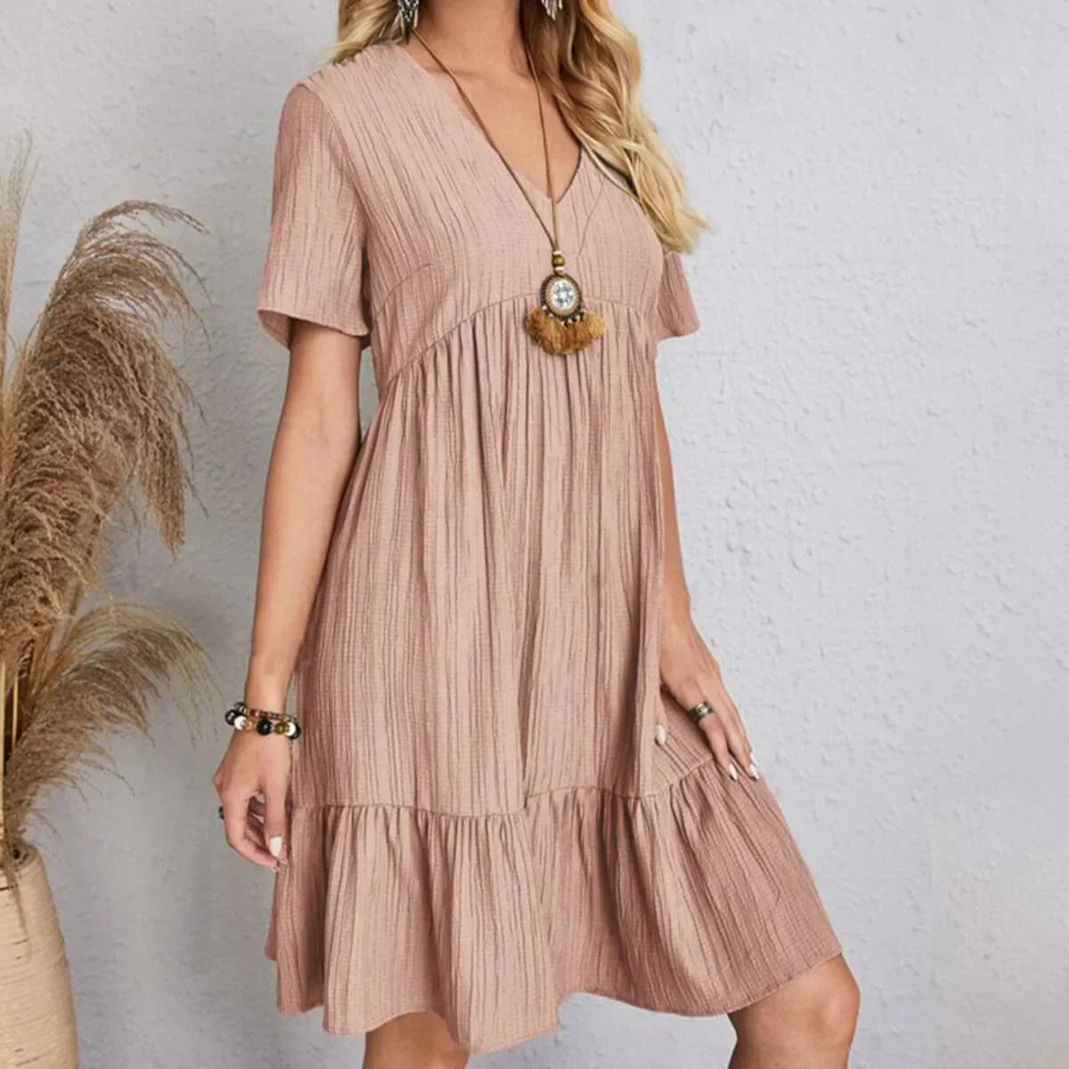 Mauve V-neck tiered midi dress with short sleeves and ruffle hem