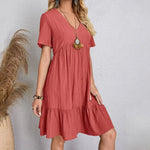 Coral V-neck tiered midi dress with short sleeves, soft draped tiers