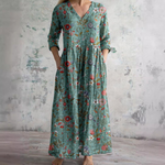 Floral long dress in teal with V-neck and three-quarter sleeves, gathered waist