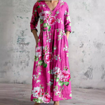 Floral long dress in magenta pink with V-neck and three-quarter sleeves, gathered waist