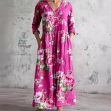 Floral long dress in magenta pink with V-neck and three-quarter sleeves, gathered waist