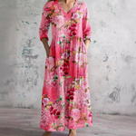 Floral long dress in rosy pink with V-neck and three-quarter sleeves, gathered waist