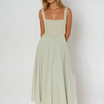 Sage green square-neck sleeveless midi dress with fitted bodice and flared skirt