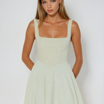 Sage green square-neck sleeveless midi dress with smooth fitted bodice and skirt flare