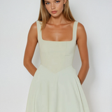 Sage green square-neck sleeveless midi dress with smooth fitted bodice and skirt flare