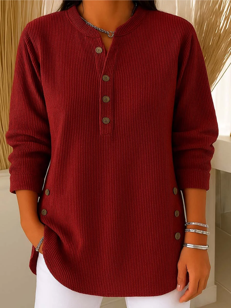 Red ribbed knit pullover with button-front placket and round neckline.