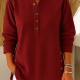 Red ribbed knit pullover with button-front placket and round neckline.