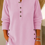 Pink ribbed knit pullover with button-front placket and round neckline.