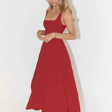 Sleeveless square-neck red midi dress with flared skirt and side-pleated look