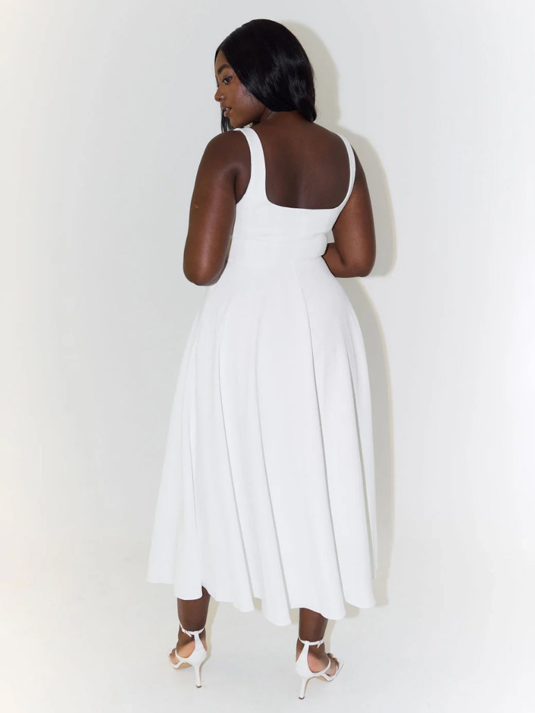 White midi dress back view, low square back, sleeveless straps, flared skirt