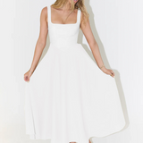 White midi dress side view, sleeveless square neckline, flared skirt, fitted waist