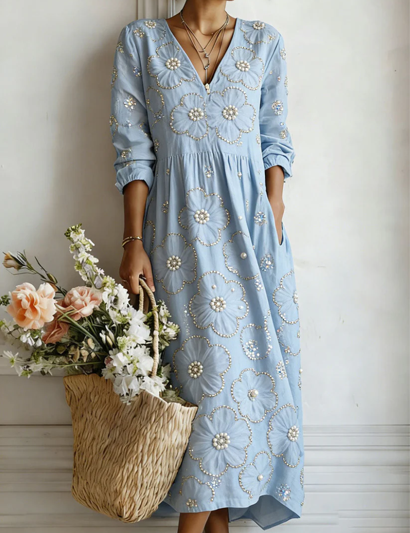 Blue floral midi dress with V-neck and 3/4 sleeves, gathered waist