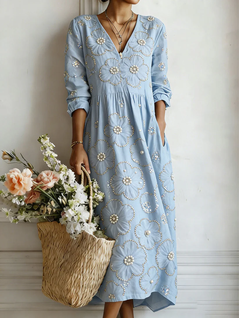 Blue floral midi dress with V-neck and 3/4 sleeves, gathered waist