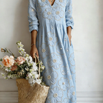 Blue floral midi dress with V-neck and 3/4 sleeves, gathered waist