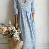 Blue floral midi dress with V-neck and 3/4 sleeves, gathered waist
