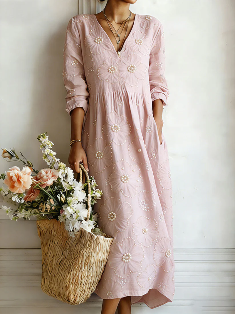 Pink floral midi dress with V-neck and 3/4 sleeves, gathered waist