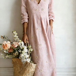 Pink floral midi dress with V-neck and 3/4 sleeves, gathered waist