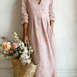 Pink floral midi dress with V-neck and 3/4 sleeves, gathered waist