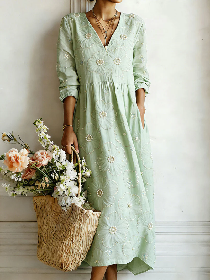 Green floral midi dress with V-neck and 3/4 sleeves, gathered waist