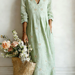 Green floral midi dress with V-neck and 3/4 sleeves, gathered waist