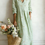 Green floral midi dress with V-neck and 3/4 sleeves, gathered waist
