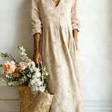 Beige floral midi dress with V-neck and 3/4 sleeves, gathered waist
