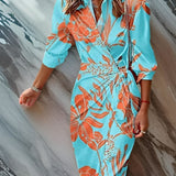 Christiana wrap dress in turquoise with orange floral print, V-neck and waist tie