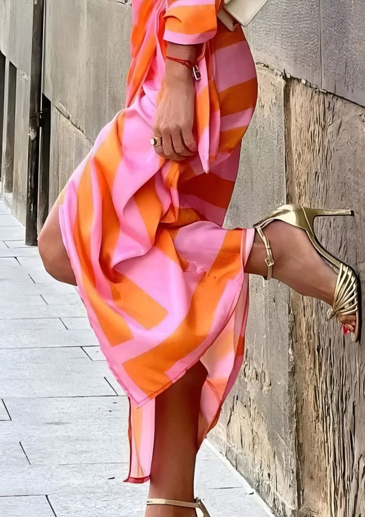 Pink and orange striped wrap dress with long draped tie and V-neck