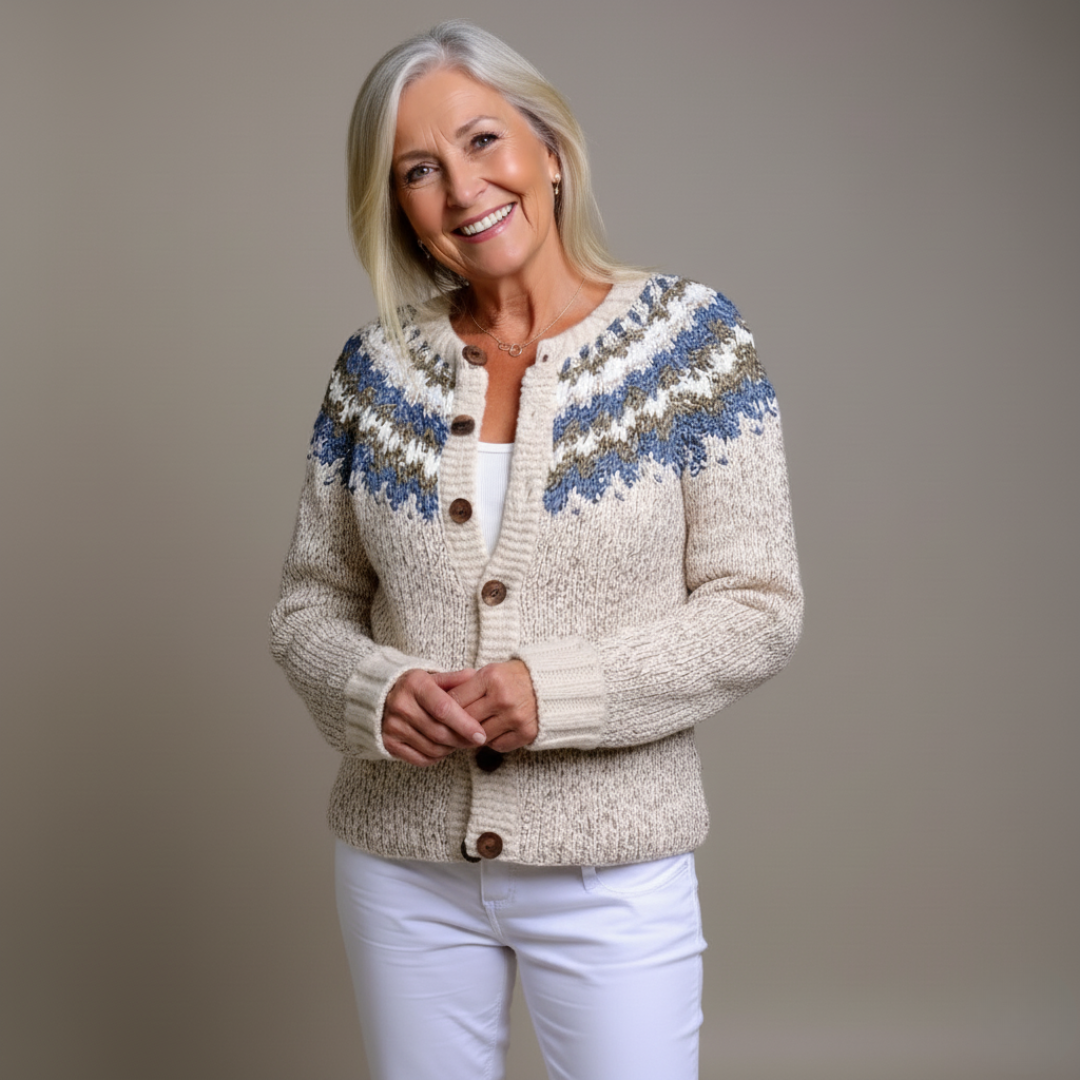 Cream chunky knit cardigan with blue patterned yoke and button-front, ribbed cuffs