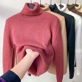Red fleece-lined turtleneck sweater with ribbed collar and long sleeves