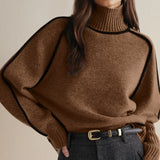 Brown turtleneck sweater with ribbed collar, cuffs, and soft knit texture