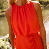 Bright orange sleeveless midi dress with gathered high neckline and layered bodice