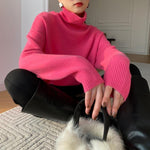 Pink long-sleeve turtleneck knit pullover with ribbed cuffs