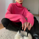 Pink long-sleeve turtleneck knit pullover with ribbed cuffs