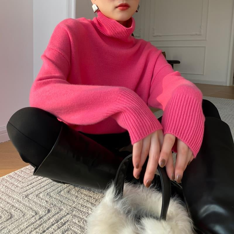 Pink long-sleeve turtleneck knit pullover with ribbed cuffs
