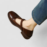 Dark brown orthopedic Mary Jane shoe with side buckle strap and low stacked sole