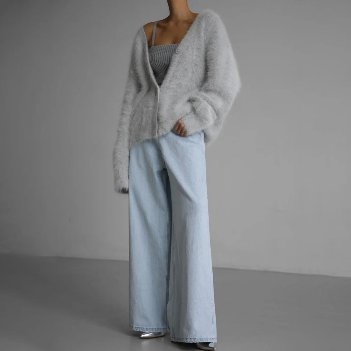 Light gray fuzzy cardigan with V-neck and button front, draped long sleeves