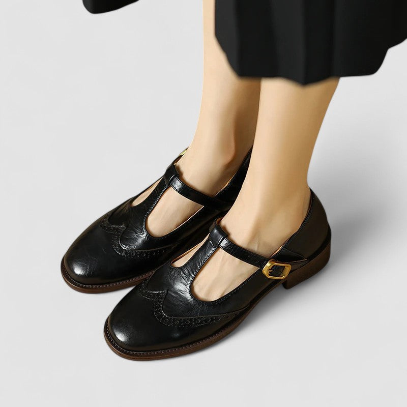 Black leather-style Mary Jane shoes with side buckle strap and low block heel