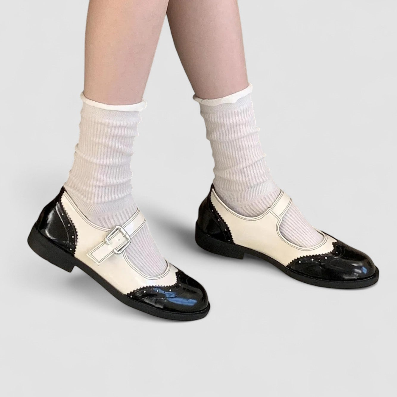 Two-tone orthopaedic Mary Jane shoes with front buckle strap and glossy black toe cap