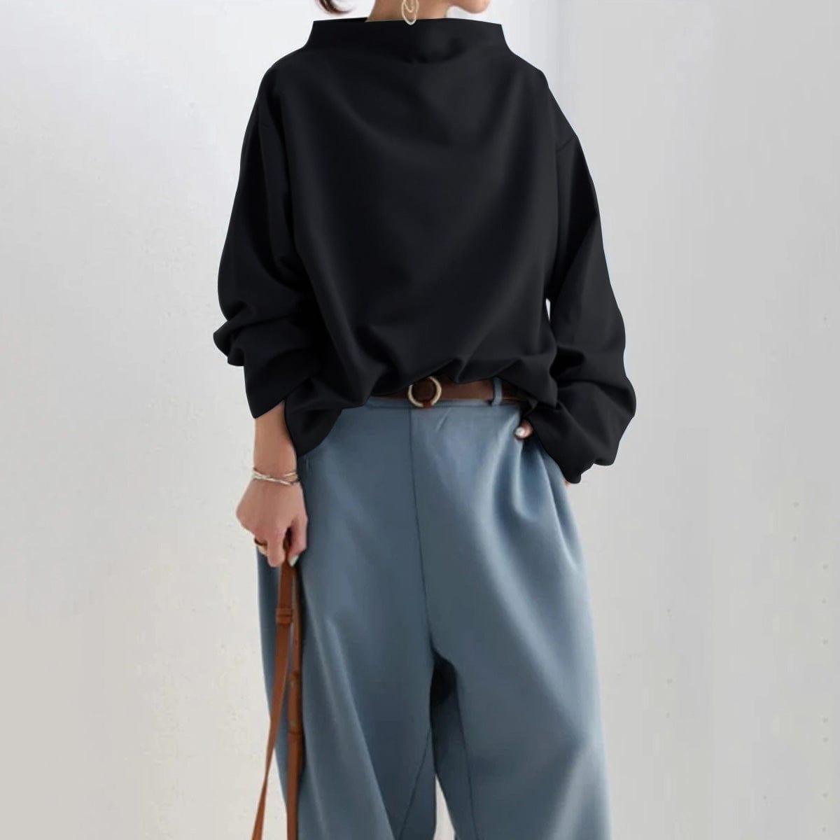 Black high-neck soft knit top with relaxed fit and long balloon sleeves
