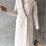 Cream double-breasted overcoat with notch lapels, long sleeves, and front button rows