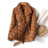 Caramel quilted puffer jacket with wrap V-neck, tie belt and long sleeves