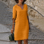Orange V-neck midi summer dress with draped sleeve detail and belly coverage