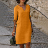 Orange V-neck midi summer dress with draped sleeve detail and belly coverage