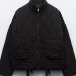 Black cropped quilted jacket with full zip and two flap pockets