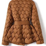 Caramel quilted puffer jacket from back with belt tie and long sleeves