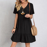 Black V-neck tiered midi dress with short sleeves and gathered skirt