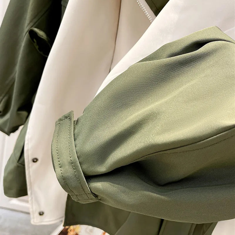 Close-up of olive-green jacket sleeve cuff with cream inner panel