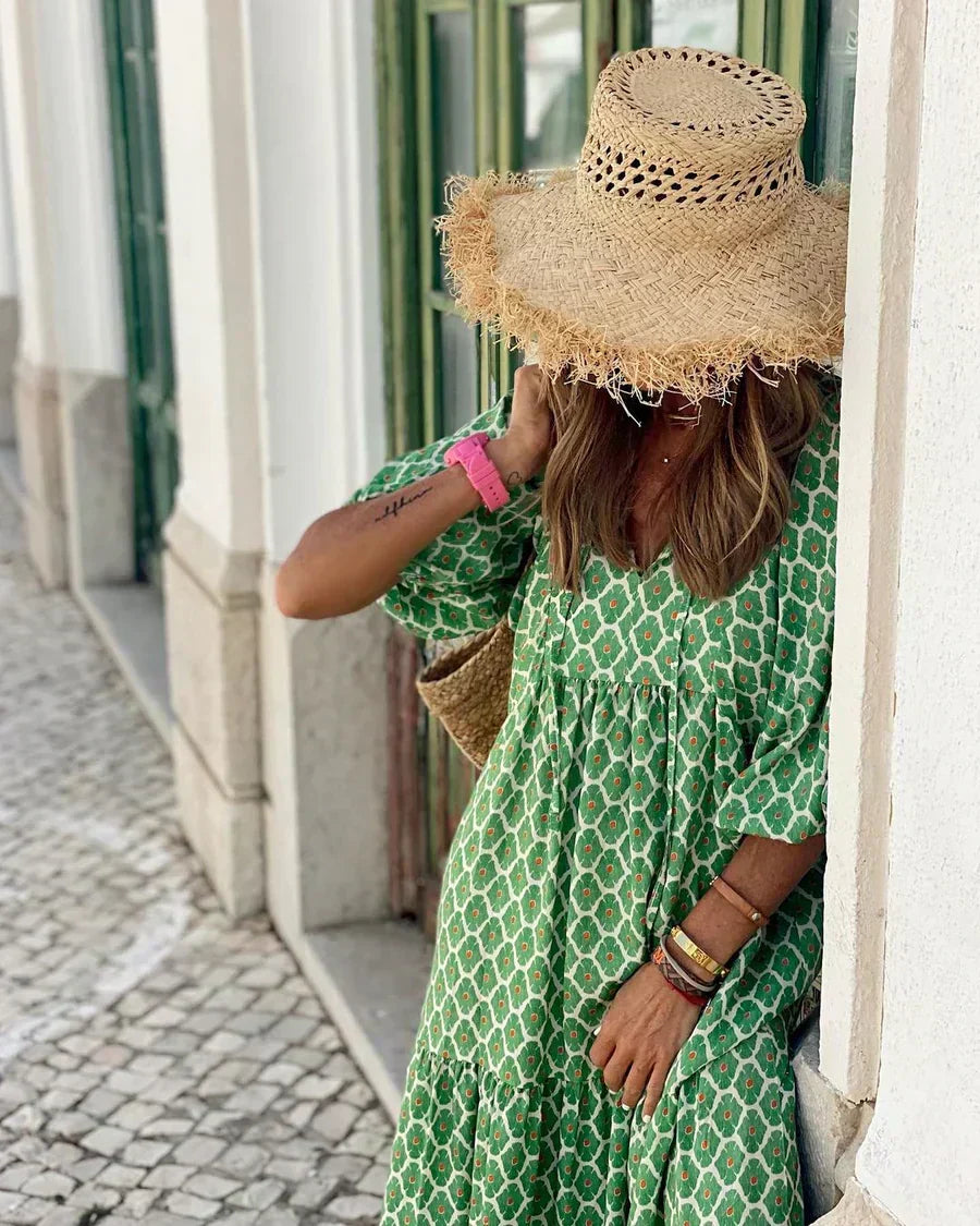 Bohemian maxi dress in green with white lattice pattern and gathered waist
