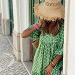 Bohemian maxi dress in green with white lattice pattern and gathered waist
